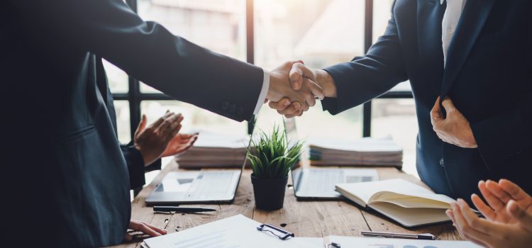 Business people shaking hands to congratulate success. Business executives handshake to congratulate the joint business agreement.